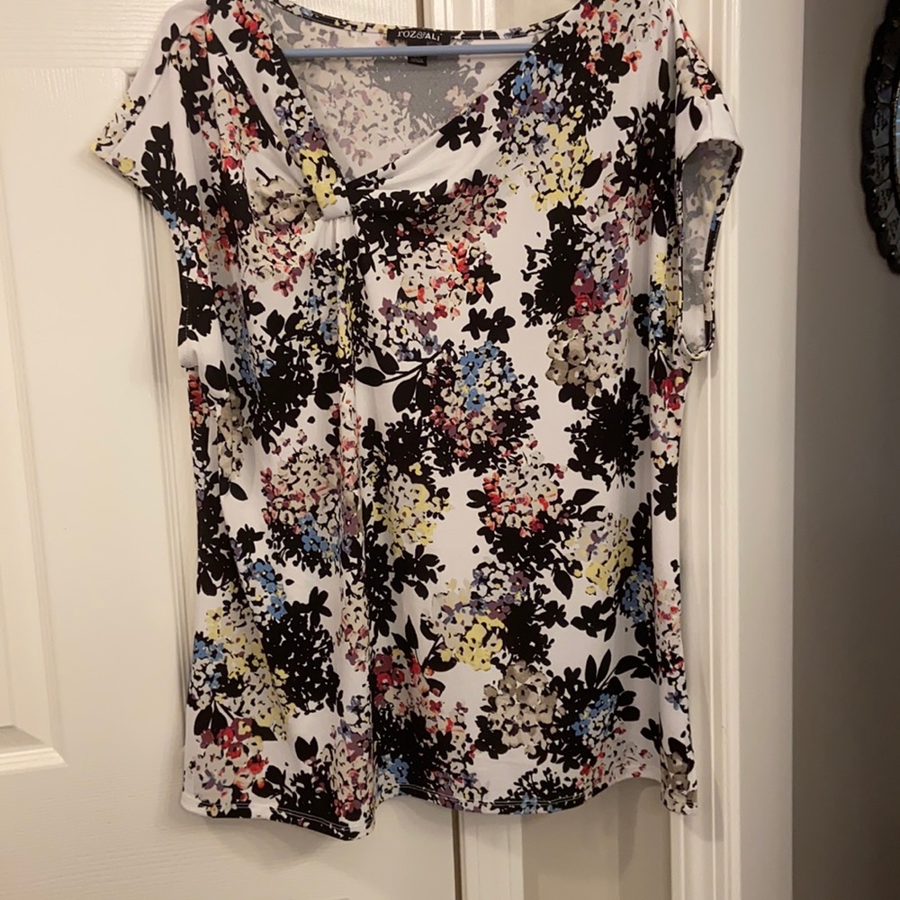 Floral print top with asymmetrical neckline
